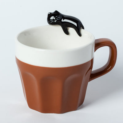 A cup full of warmth — and a cat on top!