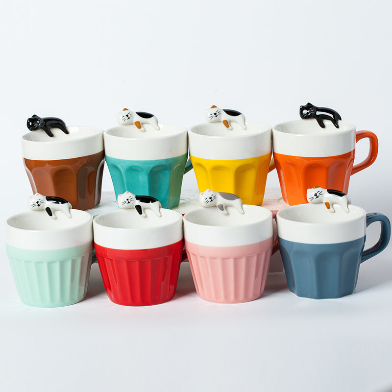 A cup full of warmth — and a cat on top!